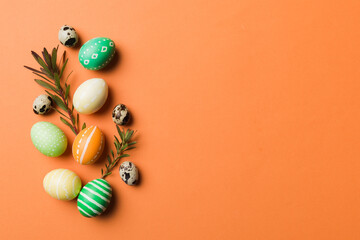 Colorful Easter eggs with spring flower leaf isolated over white background. Colored Egg Holiday border