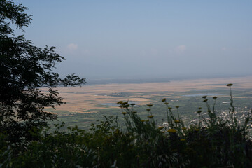 view of the city from the hill in the evening when the sea is quite dark there can be seen the roofs of buildings
