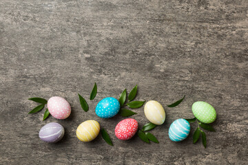 Colorful Easter eggs with spring flower leaf isolated over white background. Colored Egg Holiday border