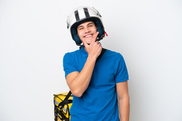 Young caucasian man with thermal backpack isolated on white background smiling