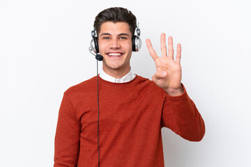 Telemarketer caucasian man working with a headset isolated on white background happy and counting four with fingers