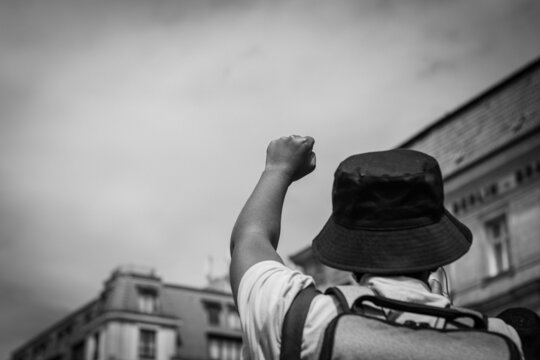 black man holding fist in the air