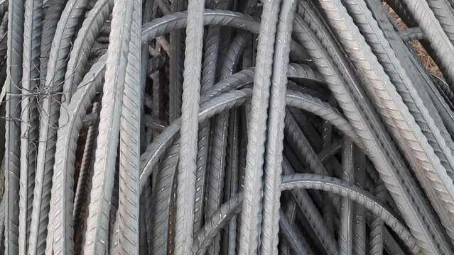 A stack of iron rods is used as material in the construction industry. TMT steel bar storage yard at the construction site. Round Shape Iron Bars