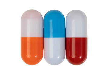 Pills. Three multi-colored capsules isolated on a white background close-up. Medico-pharmaceutical concept.
