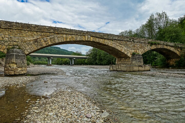 Fototapeta premium Dakhovsky picturesque stone bridge over the Dakh River Adygea. Russia. 2021.