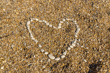 heart shaped stones at the beach
