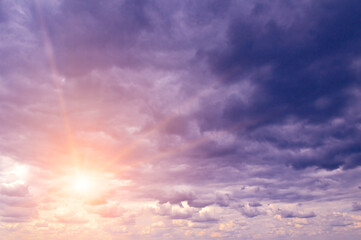 Bright majestic dawn against stormy sky.