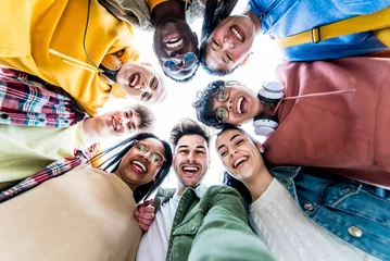 Foto op Plexiglas Multiracial group of young people standing in circle smiling at camera - International teamwork students hugging together - Human resources and youth culture concept © Davide Angelini