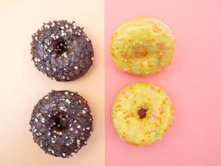Fresh chocolate donut on a pink background. Chocolate and Lemon Donut