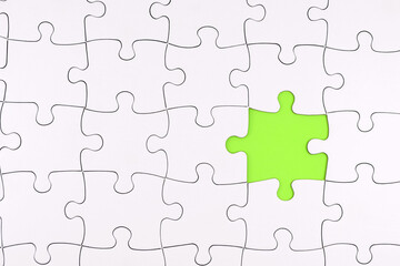 White jigsaw puzzle with one missing piece. Hiring team members, team building, solving tasks,...
