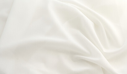 Fototapeta na wymiar Smooth elegant white silk or elegant satin texture can be used as background, elegant wedding background design.