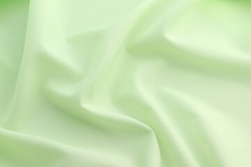 Fototapeta premium Smooth elegant green satin silk background. Copy space for text anniversary christmas background