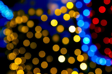 background blurred abstraction of colored lanterns and decorations. bokeh texture of street colored lights