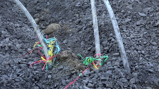 Industrial site, electric cables coming out of the ground during development works. High quality 4k footage