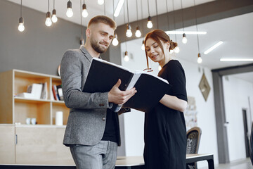 Man and woman read a business contract