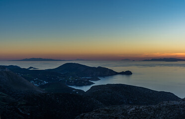 Fototapeta na wymiar An amazing sunset from the top of Syros island.