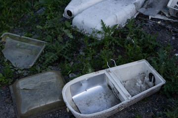 street lights dropped into the ground and have partially collapsed to form waste,.