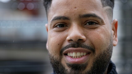A smiling happy diverse young man portrait face close-up
