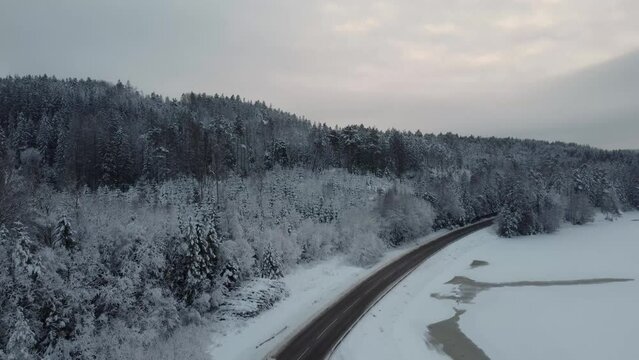 Rising Above the Dingle Dam Road Car Passing Snow Mountains Sweden 4K 30fps
