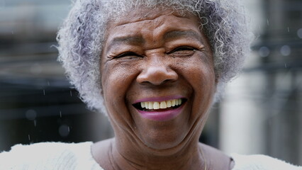 A joyful older black woman authentic smile real happy expression - obrazy, fototapety, plakaty