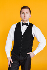 Portrait of an attractive 25 year man, future generation, businessman on yellow background in Ukraine.