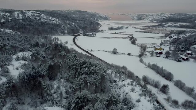 Nearing Snow Covered Road 174 Crossing Dark North Sea Views Sweden 4K 30fps
