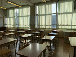 Fototapeta Japanese public school classroom with wooden chairs and desks.  obraz