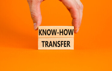 Know-how transfer symbol. Concept words Know-how transfer on wooden blocks on beautiful orange...