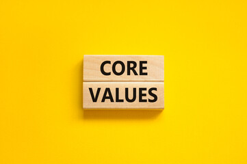Core values symbol. Concept words Core values on wooden blocks on a beautiful yellow table yellow...