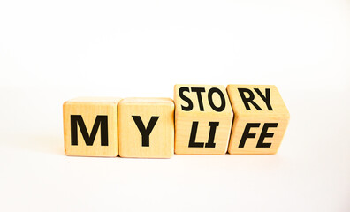 Story of my life symbol. Turned wooden cubes and changed concept words My story to My life. Beautiful white table white background. Business story of my life concept. Copy space.