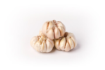 A pile of whole garlic on white background