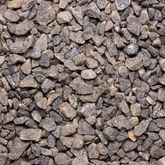 pile of gravel, commercially produced crushed granite stones, small fragment of rock taken from above, material background