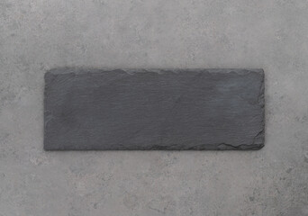 Empty stone board with copy space over stone background