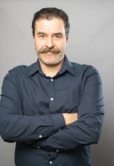 Obraz premium Silly moustache man studio portrait series on grey background