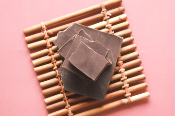 dark chocolate on a plate on table close up 