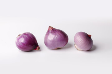 Peeled whole shallot close up on white background