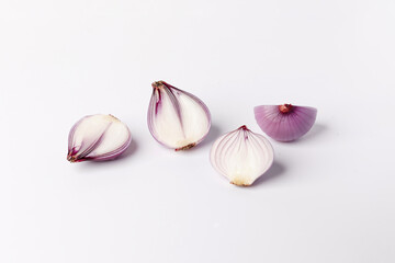 Peeled cutting shallot close up on white background