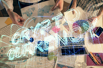 Double exposure of man and woman working together and crypto theme hologram drawing. Computer...