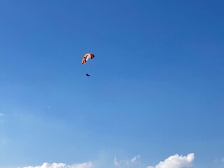Paraglider with Parachute in the sky