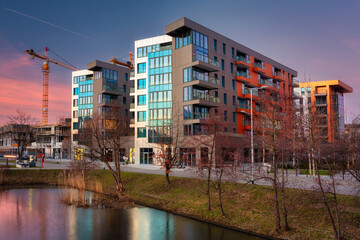 Street with new apartments at sunset in Poland