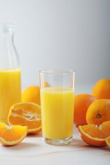 Oranges and orange juice in glasses