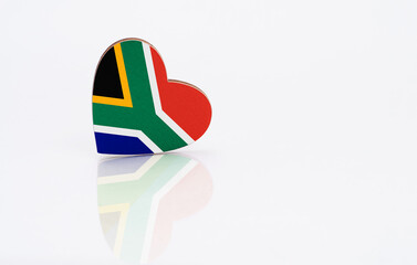 Flag of South Africa in the shape of a heart on a white background. The concept of patriotism. copy...