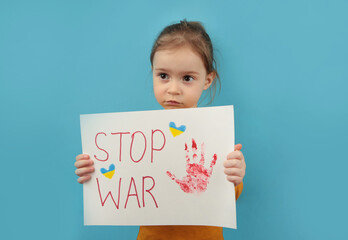 Portrait little girl calls to Stop war in Ukraine, raises banner with inscription stop the war in...