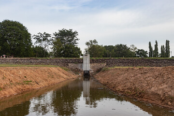 A small dam floodgates as the water dries up.