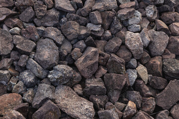 Purple-brown stones of various sizes, assorted.