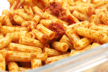 Pasta with tomato paste on the plate