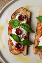 Traditional italian sandwiches with tomatoes and cream cheese, appetising commercial photo, yummy texture is visible