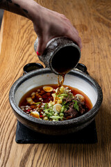 Expensive restaurant gourmet okroshka, served separated with dressing