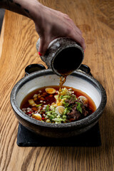 Expensive restaurant gourmet okroshka, served separated with dressing