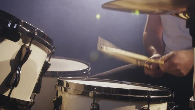 Man plays drums on stage 4K